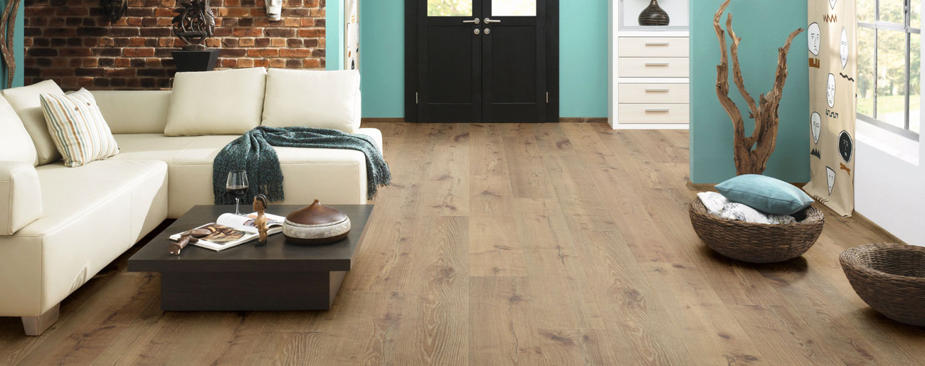 Long plank laminate flooring in an open-plan living space